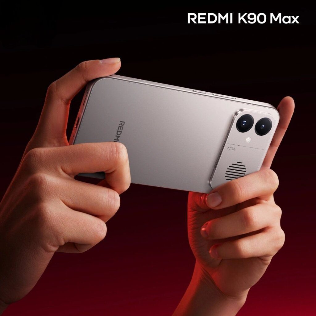 Redmi K90 Max smartphone held in landscape gaming mode showcasing dual camera setup and premium design